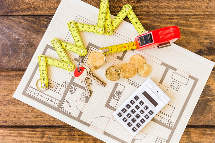 elevated view measure tape stacked coins key calculator blueprint 23 2147863919